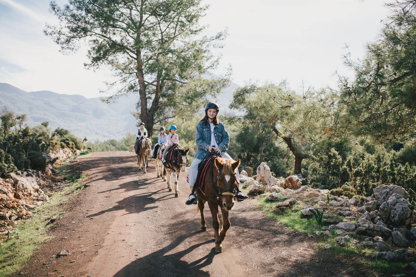 horseback riding through the mountains