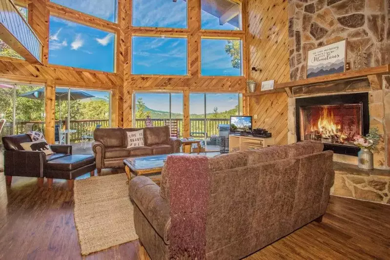 living room inside cabin with mountain views