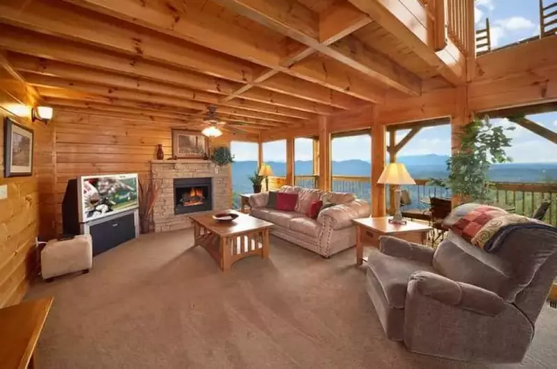 living room with large windows smoky mountain cabin