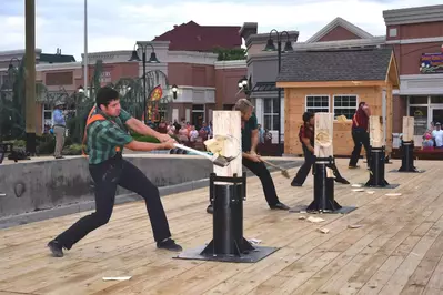 lumberjacks chopping at wood at paula deen's lumberjack feud