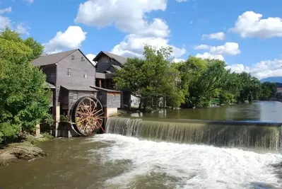 The Little Pigeon River flows by The Old Mill in Pigeon Forge.