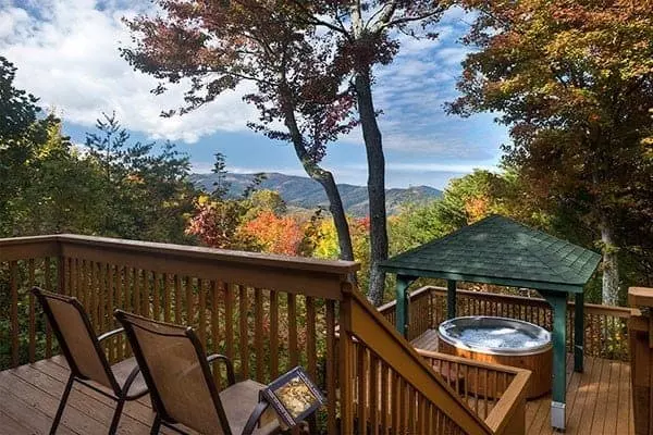 Chairs and a hot tub on the deck of the Heavenly View cabin in Gatlinburg.