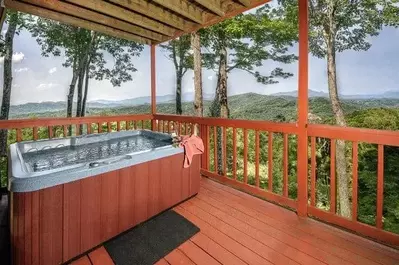 Hot tub on the deck with mountain views at La Bella Vista cabin in Gatlinburg.