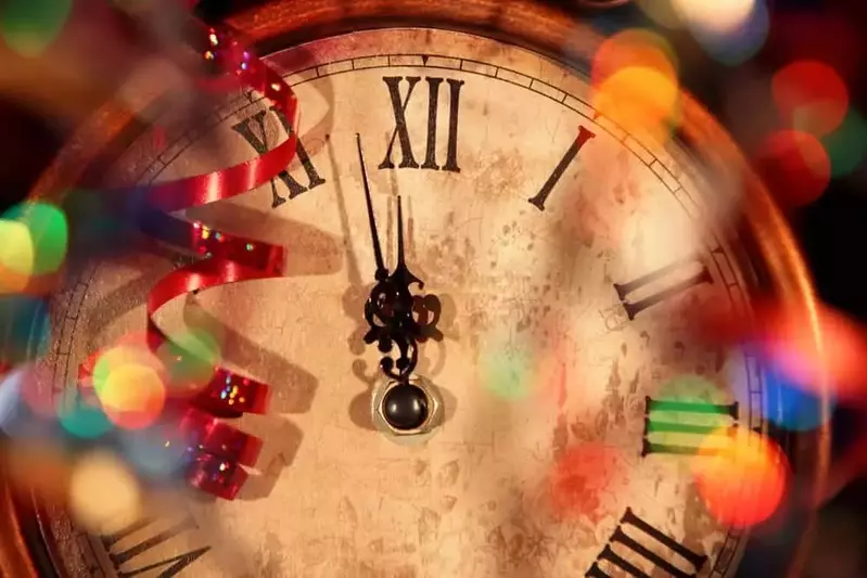 A clock about to strike midnight on New Year's Eve in Gatlinburg cabin rentals.