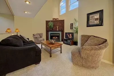 The living room with a fireplace at the Serene Getaway cabin.