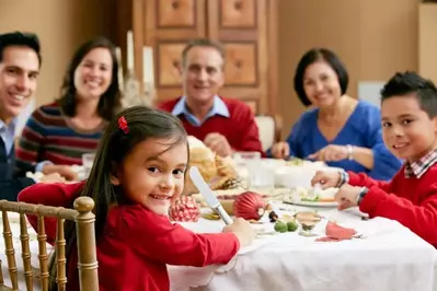 Multi-generational family enjoying a Christmas dinner together.