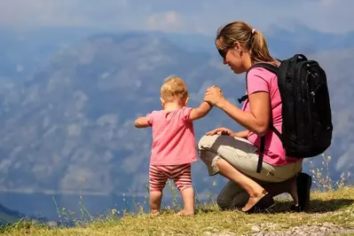 mom and daughter looking out at Smoky Mountains