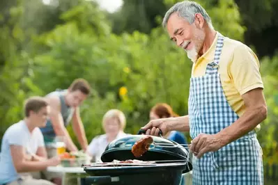 family grilling burgers during a Smoky Mountain cabin vacation