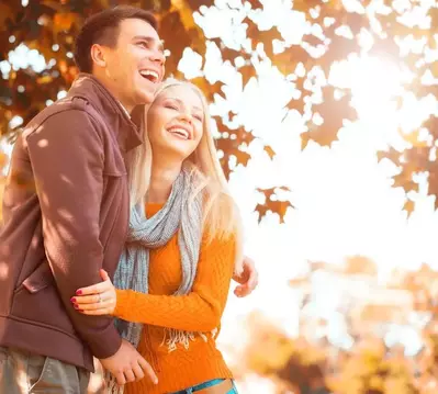 Couple in the park in autumn