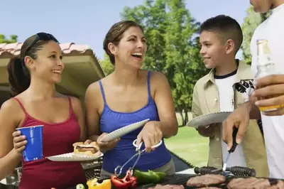 Family grilling outside for dinner