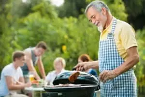 family grilling burgers during a Smoky Mountain cabin vacation