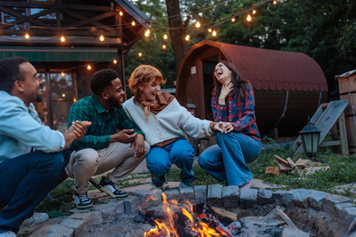 group around a fire in smoky mountains